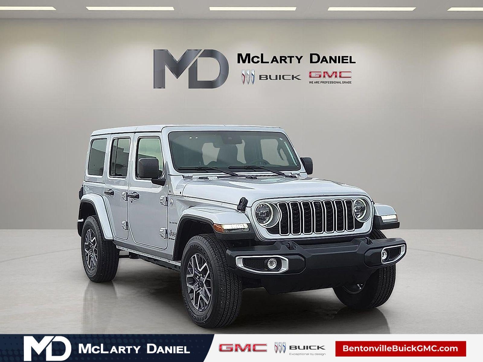 2024 Jeep Wrangler 4-Door Sahara 4x4 in Silver — front three-quarter view