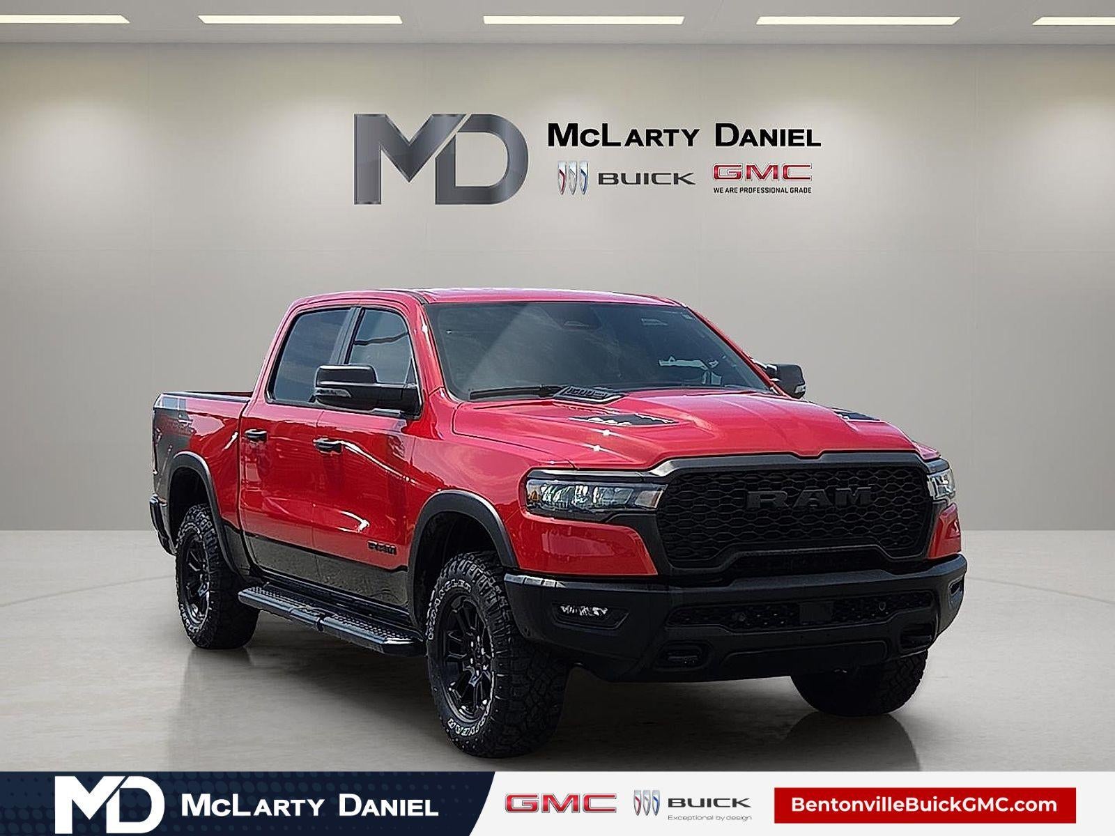 2025 RAM 1500 Rebel Crew Cab 4x4 5'7" Box in Red — front three-quarter view