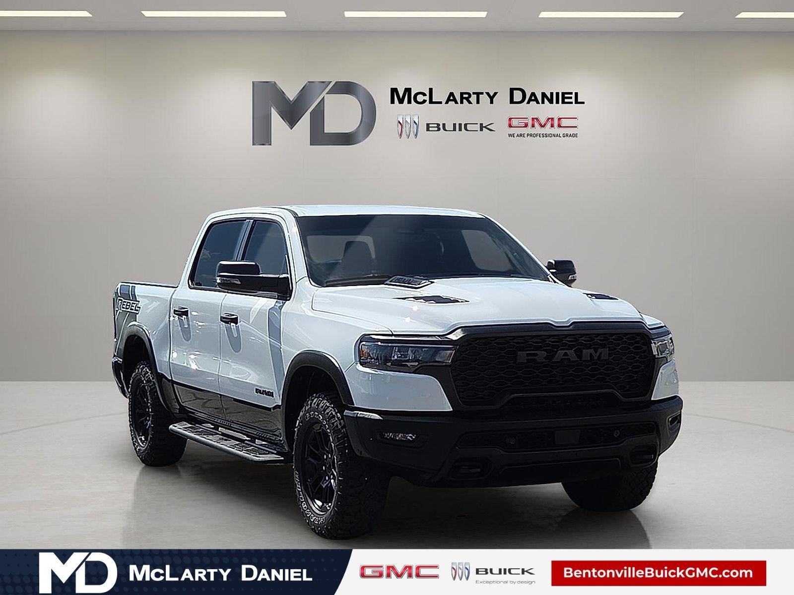 2025 RAM 1500 Rebel Crew Cab 4x4 5'7" Box in White — front three-quarter view