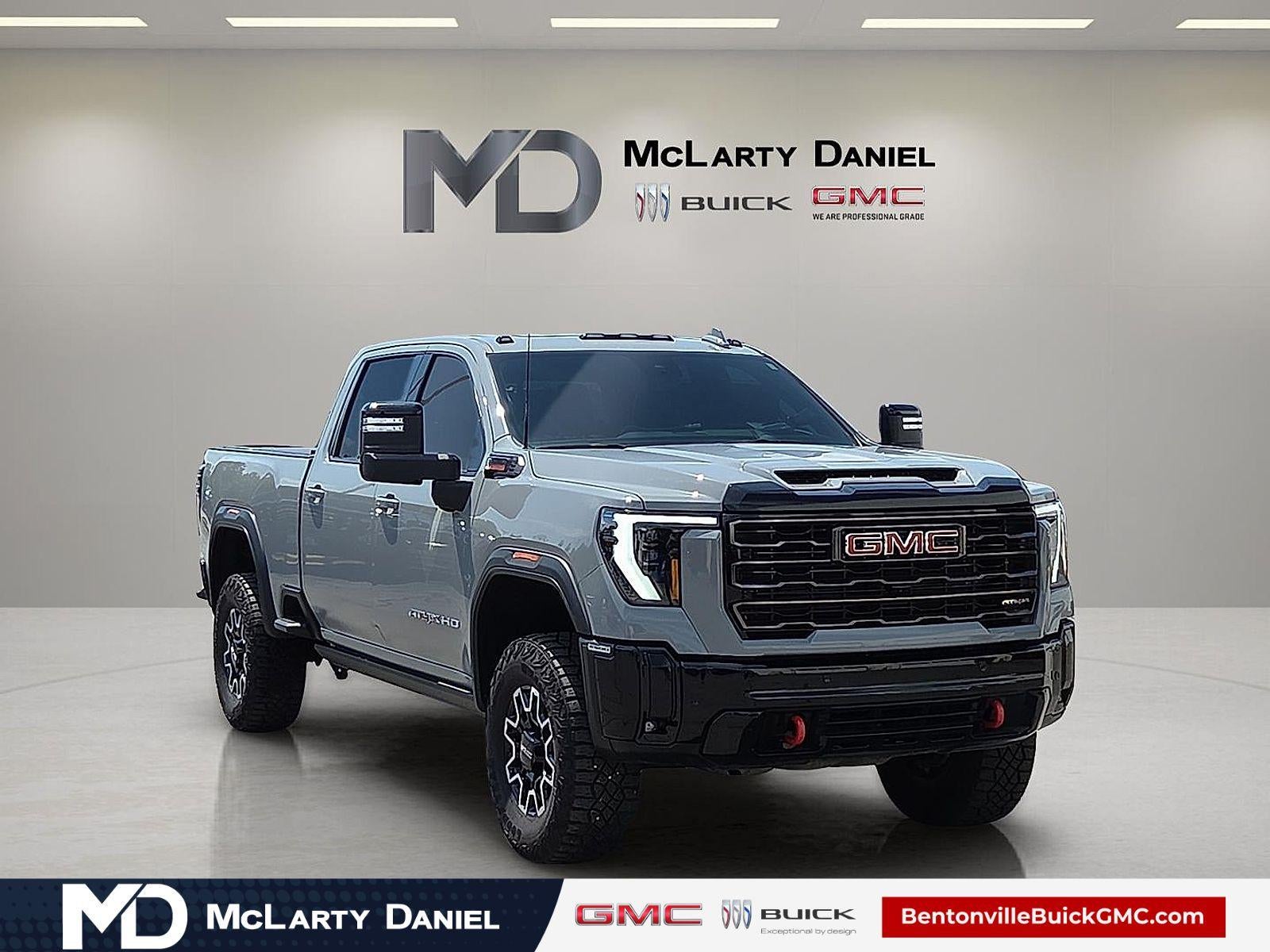 2025 GMC Sierra 2500 HD AT4X in Thunderstorm Gray — front three-quarter view