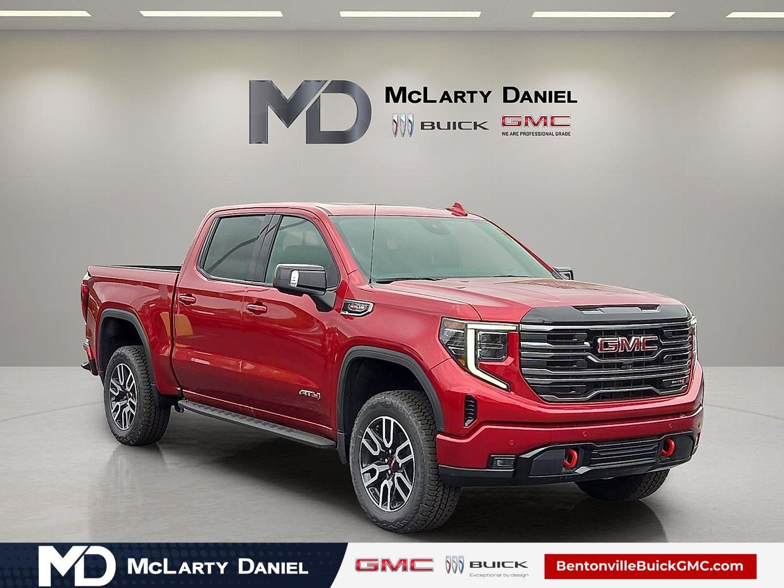 2026 GMC Sierra 1500 AT4 in Volcanic Red Tintcoat — front three-quarter view