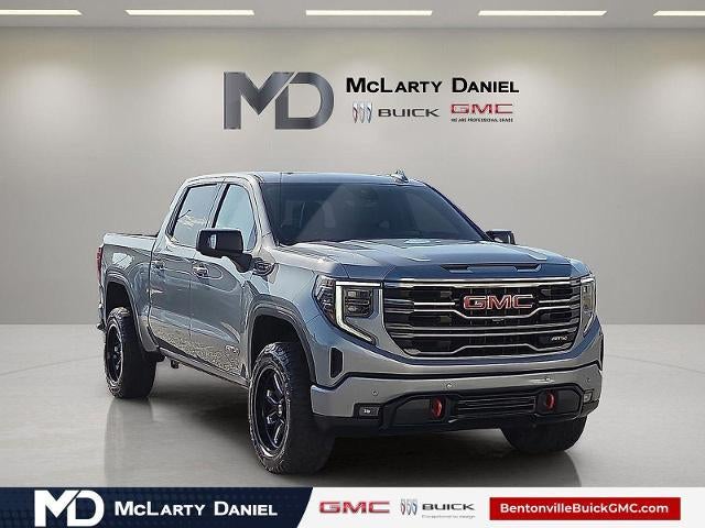 2024 GMC Sierra 1500 AT4 in Sterling Metallic — front three-quarter view