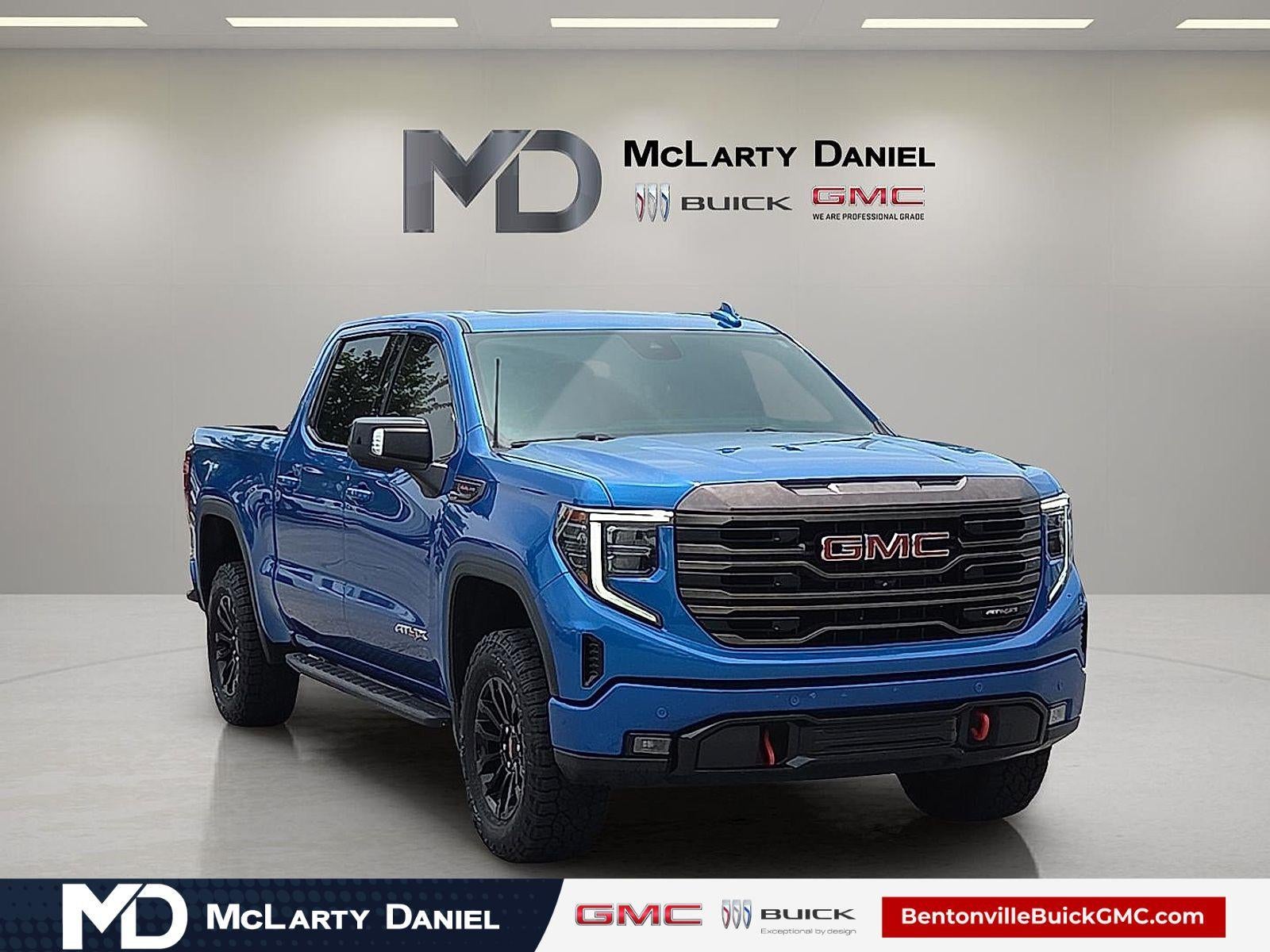 2022 GMC Sierra 1500 AT4X in Dynamic Blue Metallic — front three-quarter view