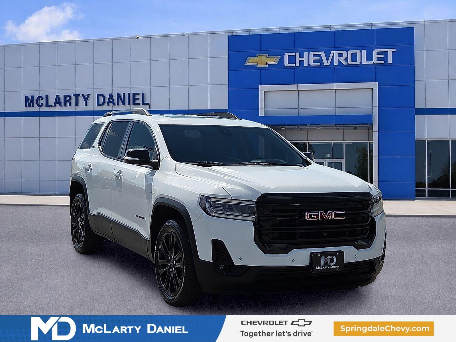 2023 GMC Acadia SLT in Summit White — front three-quarter view