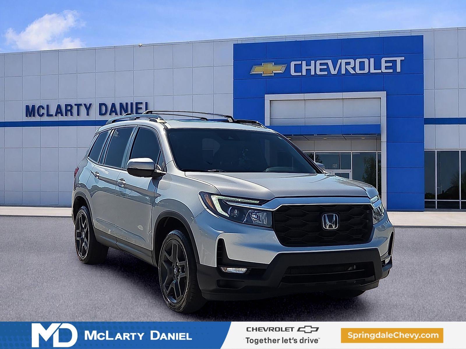 2023 Honda Passport AWD EX-L in Silver — front three-quarter view