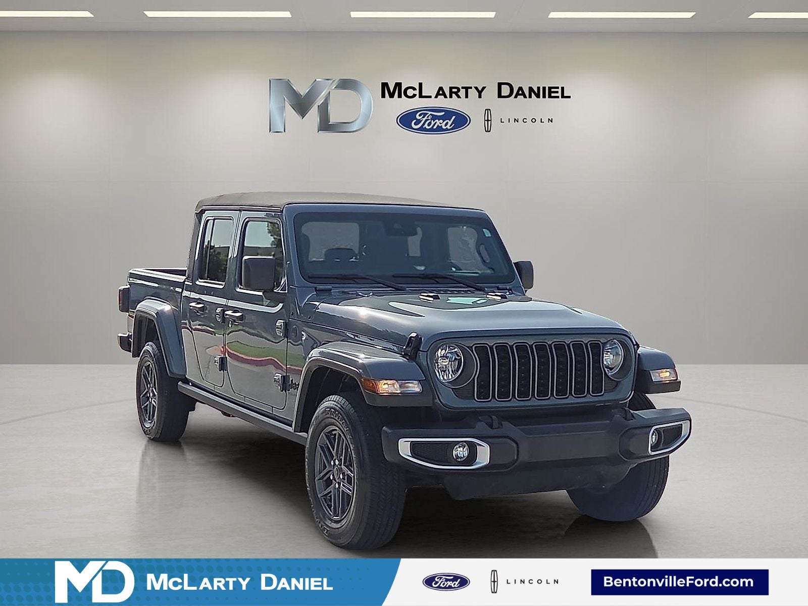2024 Jeep Gladiator Sport S in Anvil Clear Coat — front three-quarter view