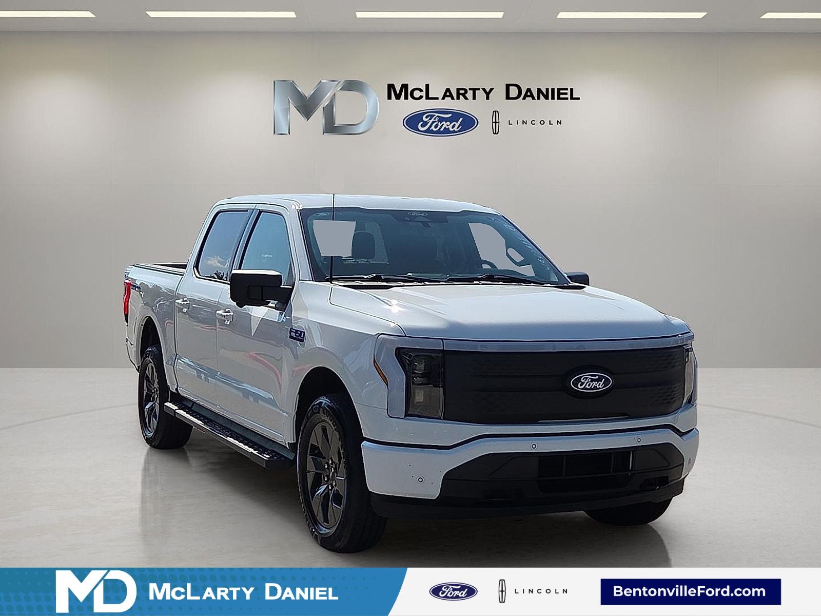 2024 Ford F-150 Lightning Flash in Oxford White — front three-quarter view