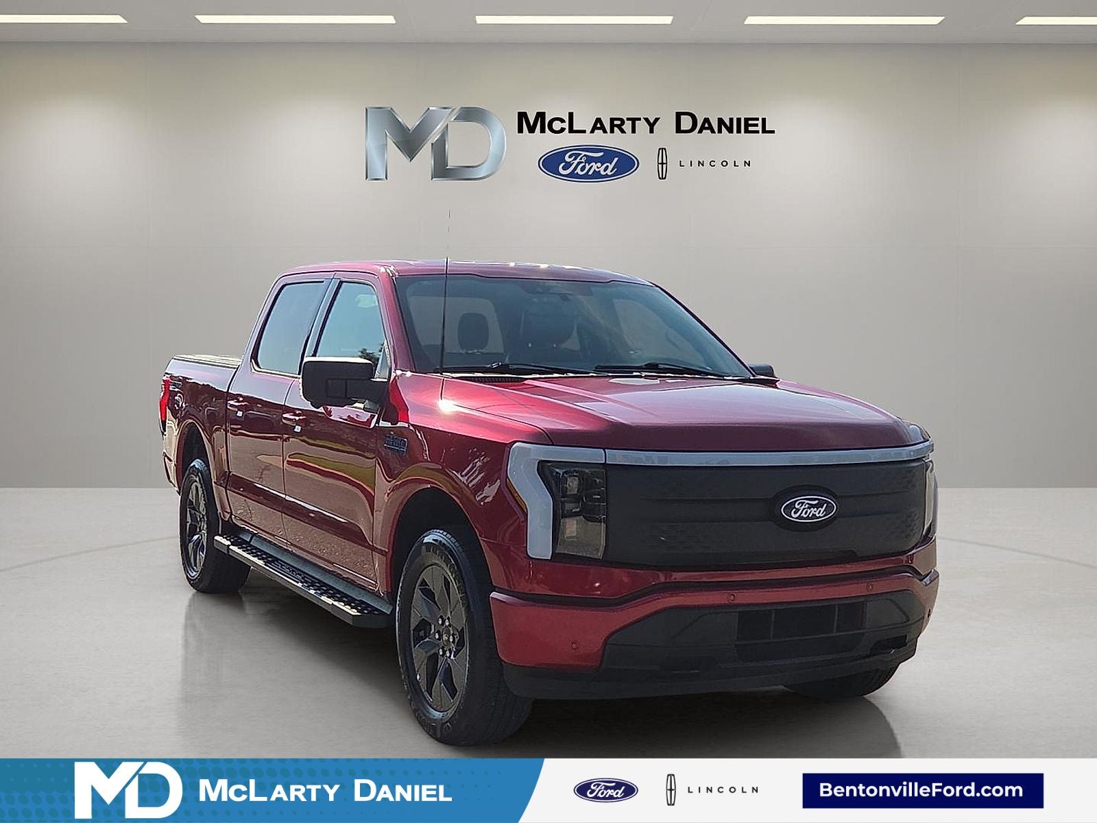 2025 Ford F-150 Lightning Flash in Red Metallic — front three-quarter view