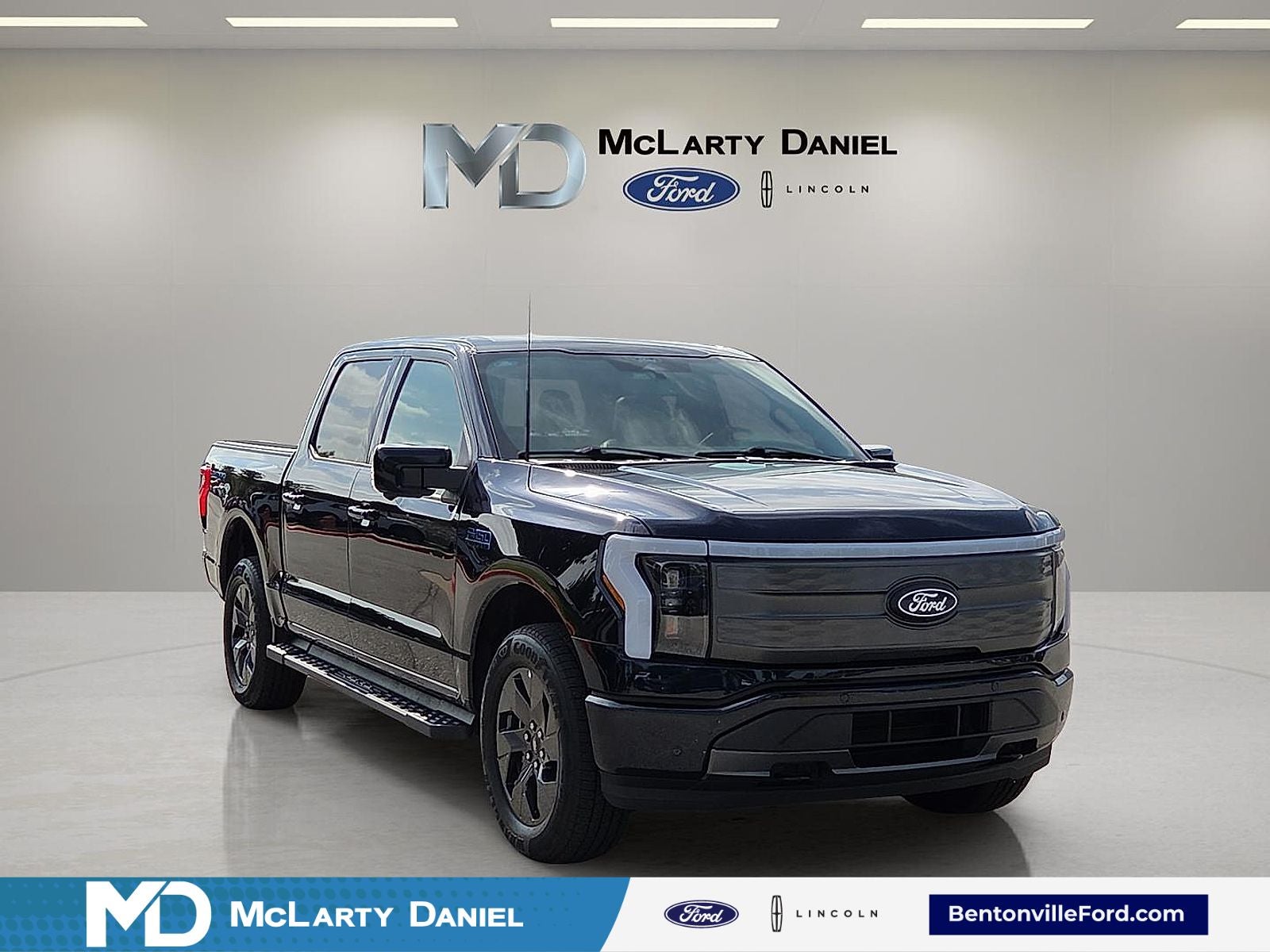 2025 Ford F-150 Lightning Lariat in Blue Metallic — front three-quarter view