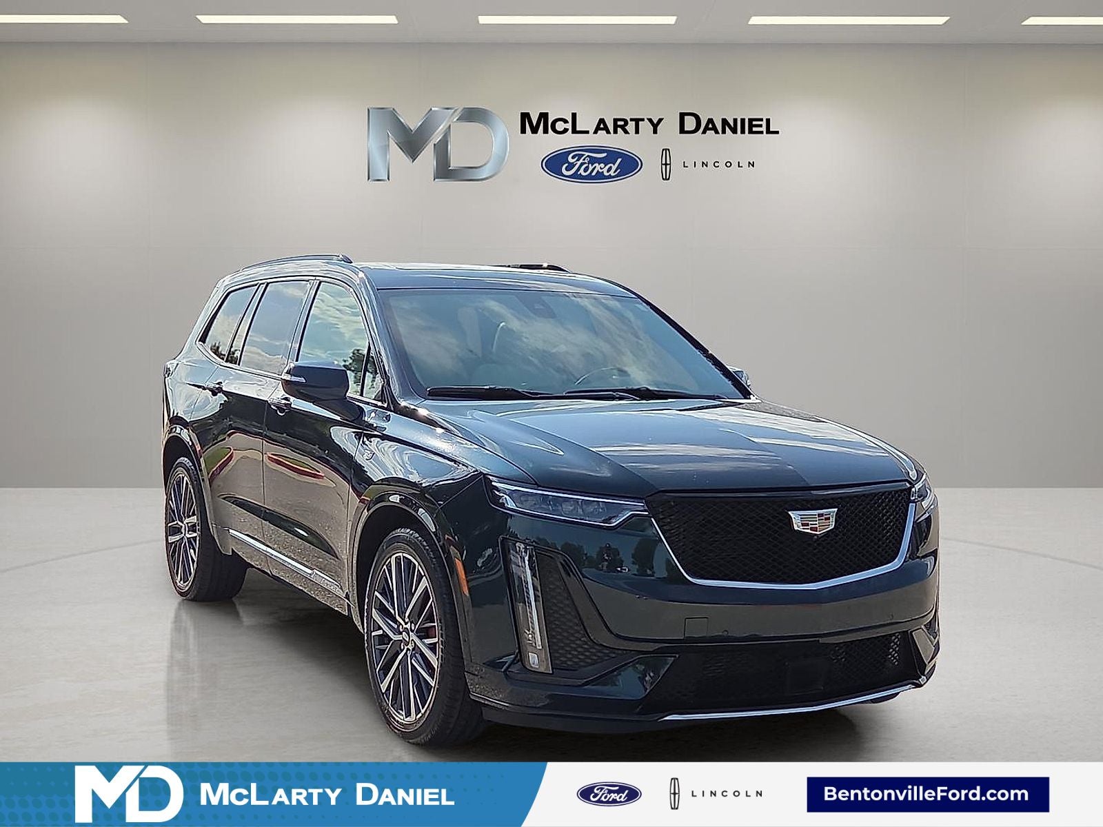 2024 Cadillac XT6 Sport in Emerald Lake Metallic — front three-quarter view
