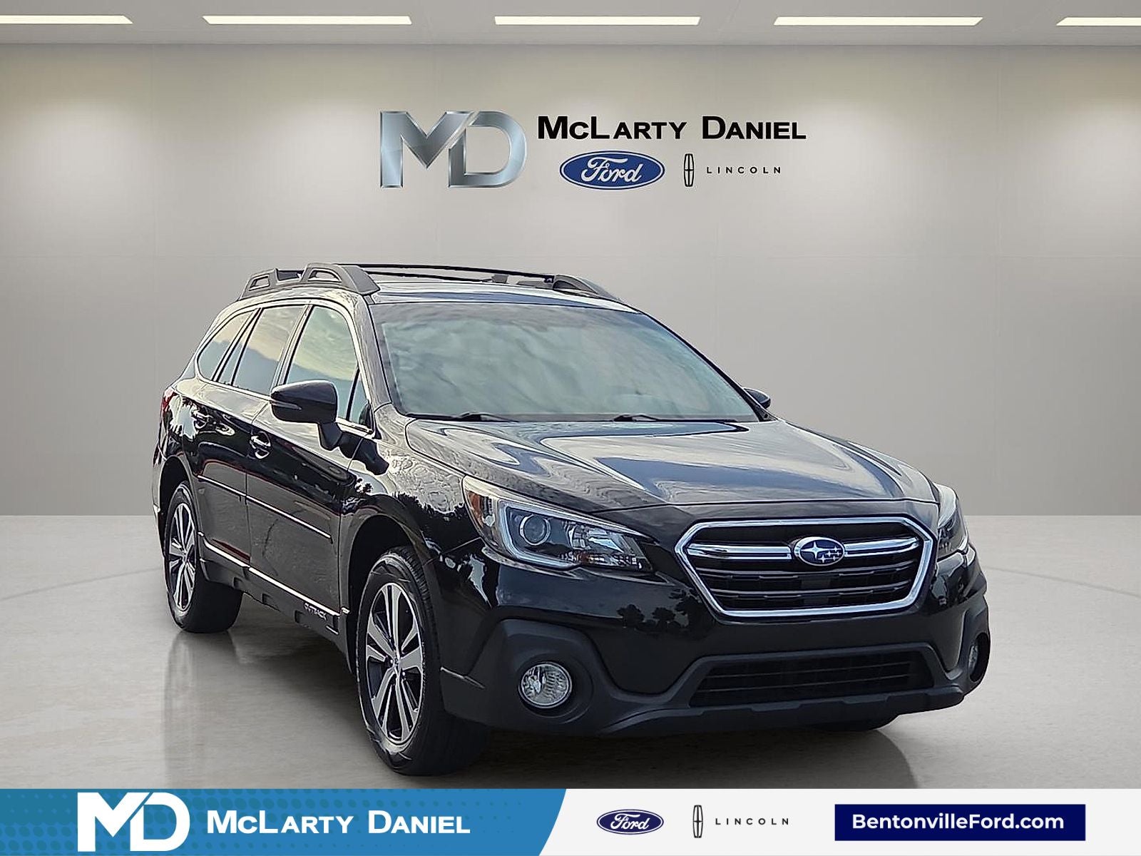 2018 Subaru Outback 2.5i Limited in Crystal Black Silica — front three-quarter view