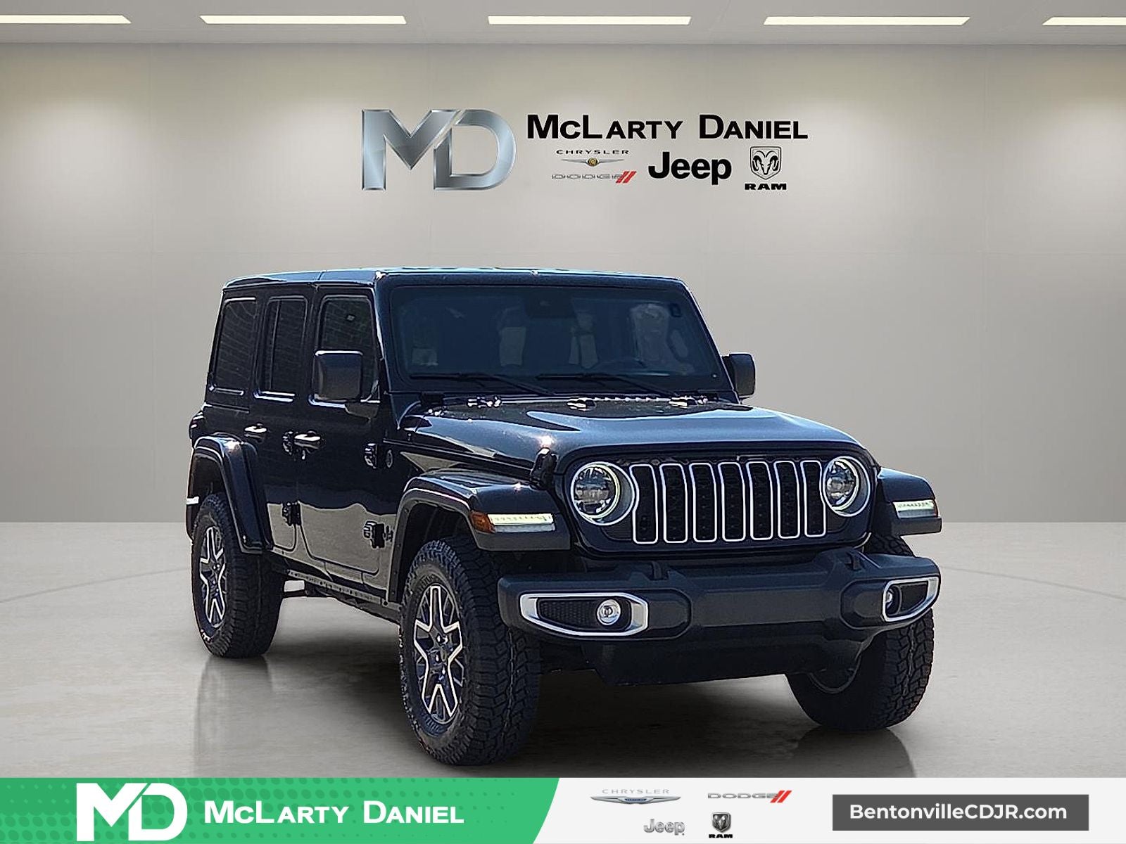2025 Jeep Wrangler 4-Door Sahara 4x4 in Black Clearcoat — front three-quarter view